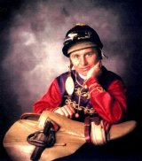 Willie Carson wearing the Queen's racing colours