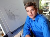 Jonathan Foyle in his studio with his drawing of The Colosseum