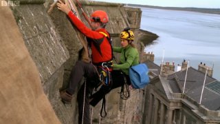 Jonathan Foyle and Lucy Creamer on the walls of Caernarvon Castle in 'Climbing Great Buildings'